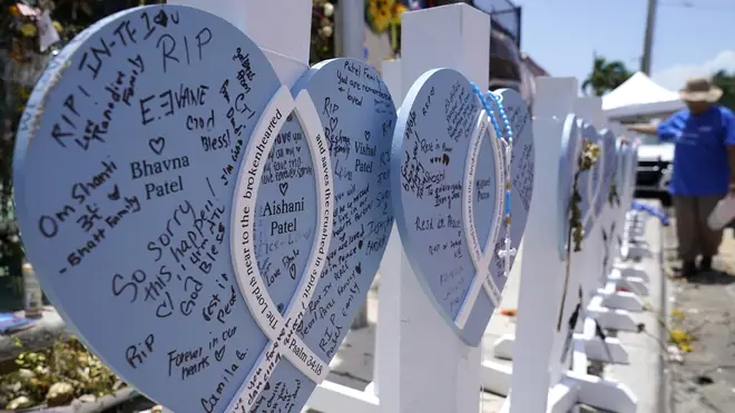 A wooden heart at a makeshift memorial for the victims of the collapse of the Champlain Towers South building