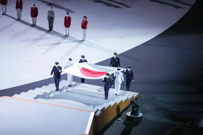 The Japan flag being carried on stage 