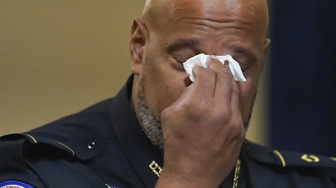 US Capitol Police Sgt Harry Dunn wipes his eyes during the House select committee hearing (Andrew Harnik, Pool/AP)