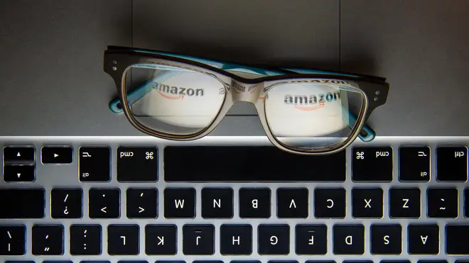 The logo of internet retailer Amazon reflected in a pair of glasses