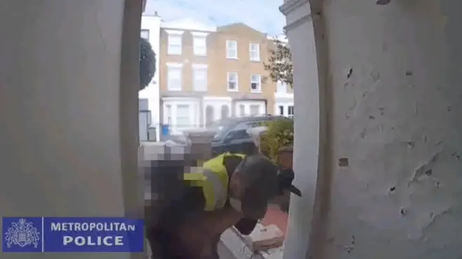The pair grappled on the doorstep before bystanders rushed to help the victim