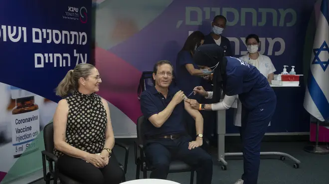 Israeli president Isaac Herzog receives his booster jab