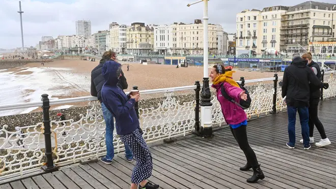 Strong winds weren't enough to stop some people enjoying Brighton pier