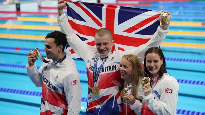 Adam Peaty, James Guy, Anna Hopkin and Kathleen Dawson celebrate their gold medal