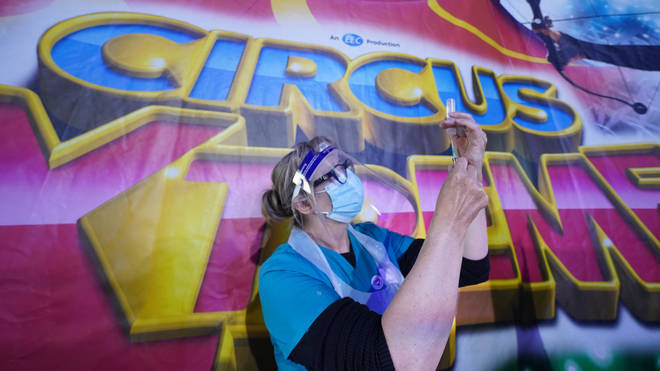 Dr Lisa Pickles, clinical lead for the Calderdale vaccination program, prepares a syringe at Circus Extreme