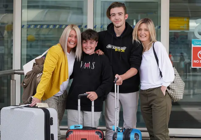 Michelle Bolger with her sons Taran and Kaie alongside her sister Elaine Burt at Glasgow Airport