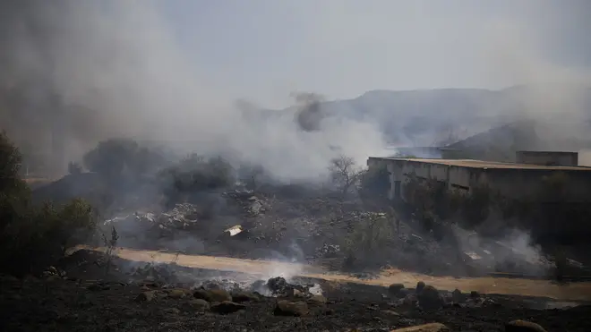 Fields burning after rocket fire