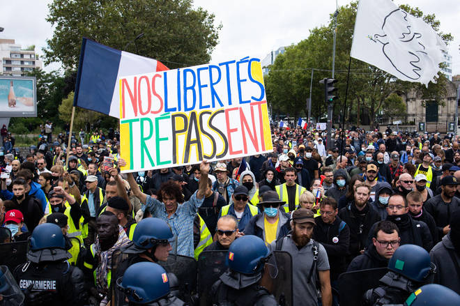Protesters took to the streets across France on Saturday for the fourth weekend in a row to rally against a new health pass needed to enter a cafe or travel on an inter-city train, two days before the new rules come into force.