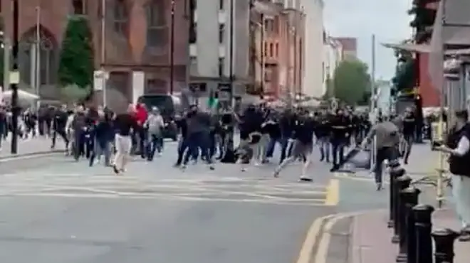 Dozens of men could be seen brawling on a street ahead of the game