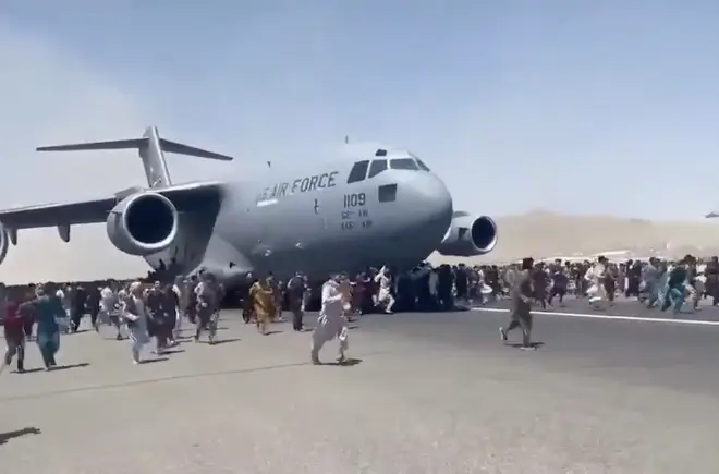 People desperately run alongside US Air Force plane in bid to leave Afghanistan