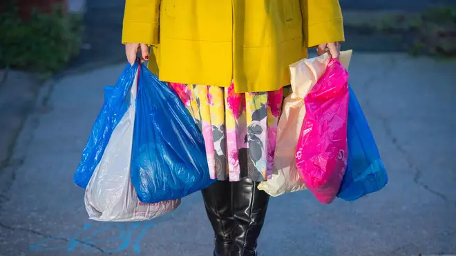 Shopping being carried in plastic carrier bags