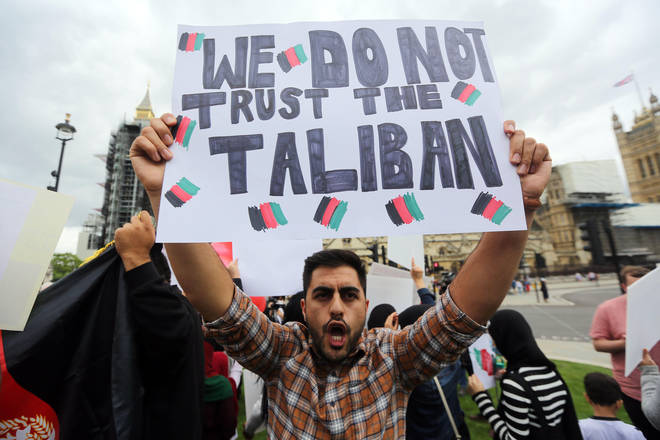 Afghans stage a protest outside British parliament asking international community not to recognise the Taliban.