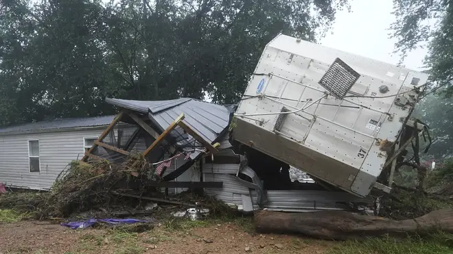 A mobile home and a truck trailer washed away by flooding in McEwen, Tennessee