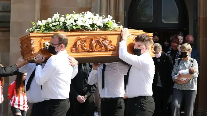 The coffin of Samantha Willis from Strathfoyle is taken from St Columb's Church, Londonderry, after her funeral. The mother-of-four died with Covid-19 shortly after giving birth on Friday.