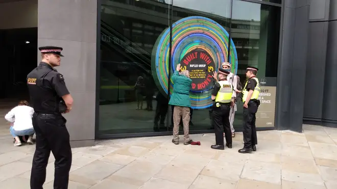 Extinction Rebellion activists stuck up signs on targeted buildings.