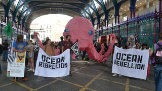 Animal Rebellion protesters at Smithfield market, taking part in an Animal Rights March, as part of Extinction Rebellion's UK Rebellion.