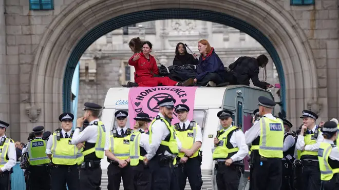 Extinction Rebellion protesters have blocked Tower Bridge after descending on London on Monday