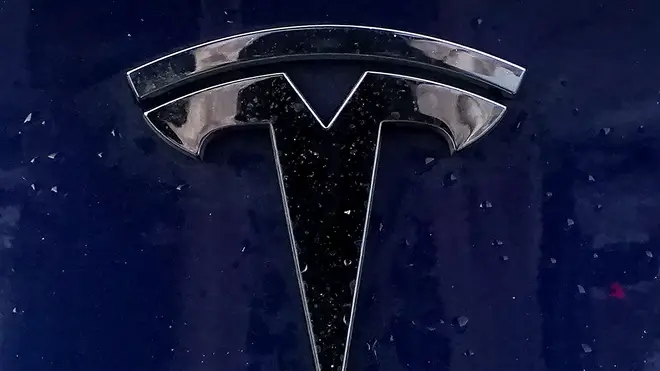 A Tesla electric vehicle emblem