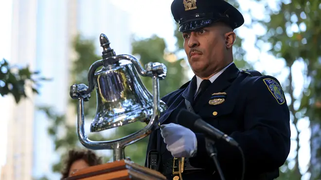 A bell was rung to signal six minutes of silence during the ceremonies.
