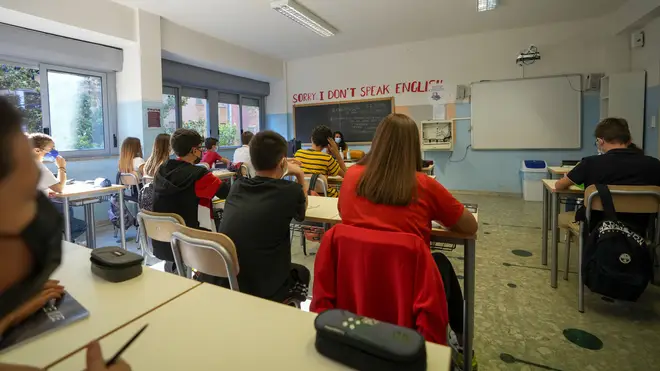 A teacher and students wear face masks during a lesson, at the Isacco Newton high school, in Rome (Andrew Medichini/AP)