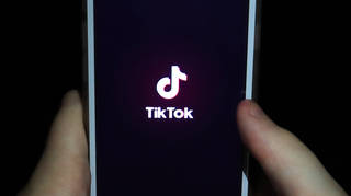 A girl uses the TikTok app on a smartphone