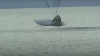 The SpaceX capsule carrying four people splashes down in the Atlantic off the Florida coast