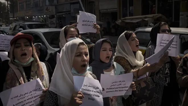 Women march to demand their rights under Taliban rule during a demonstration near the former Women’s Affairs Ministry building in Kabul, Afghanistan (AP)
