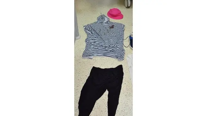 Police said that she was discovered wearing a blue striped t-shirt, black trousers and a pink hat.