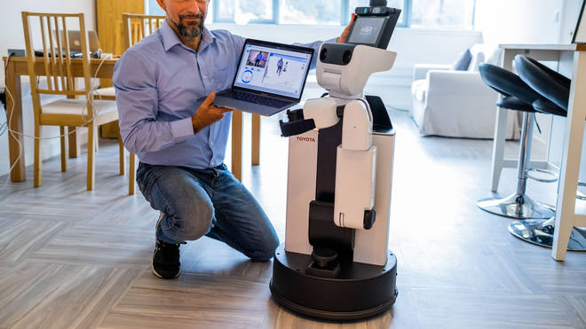 Dr Mauro Dragone with the assisted living robot