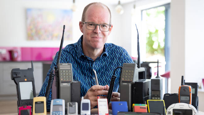 Ben Wood, founder of the Mobile Phone Museum, pictured with some of the over 2,000 unique mobile phones that will be part of the online museum when it launches in November