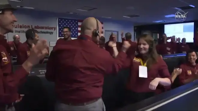 NASA Employees Celebrate Mars Landing With Out of This World Handshake