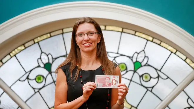 Sarah John with a new banknote