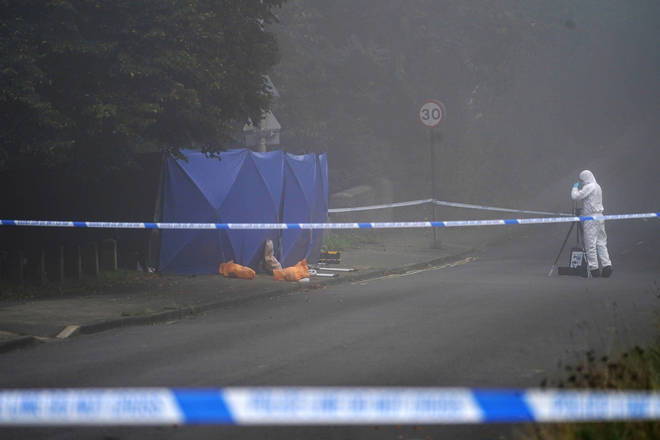 Forensic investigators at the scene in Oxford today