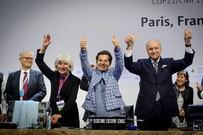 French Foreign Minister Laurent Fabius (right), United Nations climate chief Christiana Figuere (centre) and Laurence Tubiana celebrating the agreement on climate change at COP21 - known as the Paris agreement