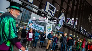 Climate protesters who will demonstrate in Glasgow gather in Rotterdam before heading to Scotland