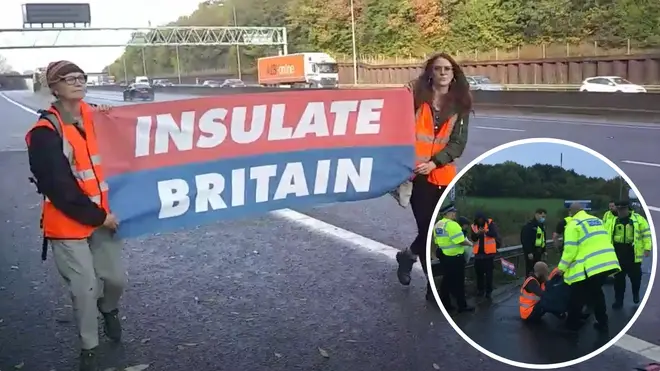 Protesters walk down the M25. Earlier they blocked the motorway between junction 28 and 29
