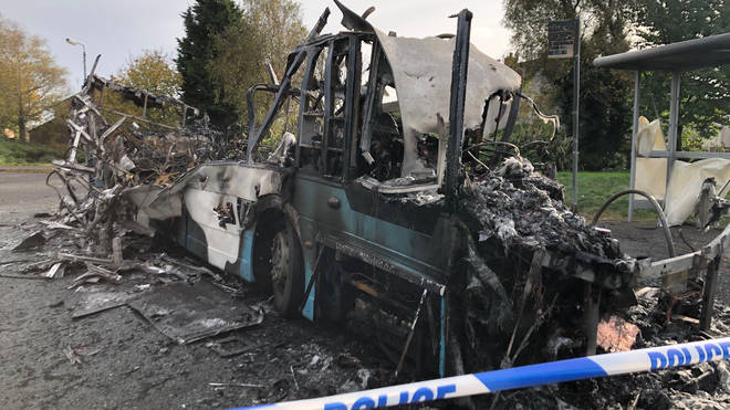 The bus was set alight by masked men on Monday morning
