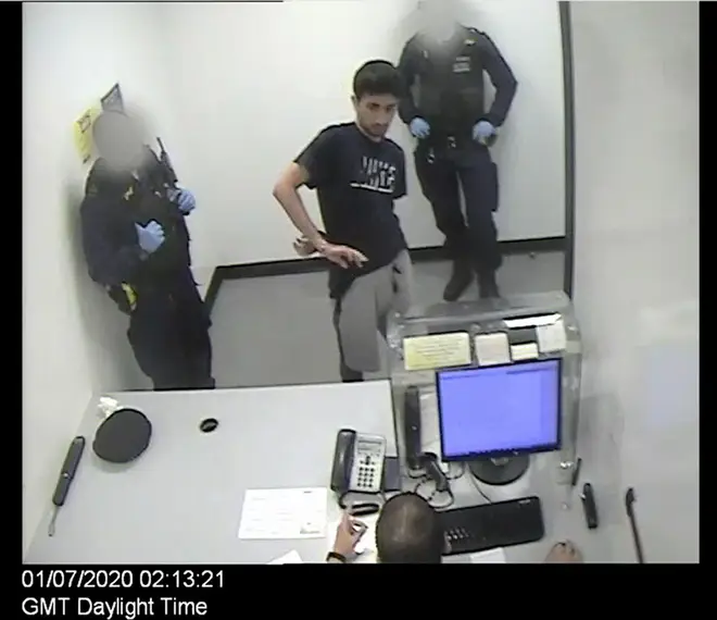 Hussein in Wandsworth Police Station after his arrest
