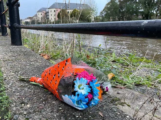Flowers left by the River Cleddau in Haverfordwest.