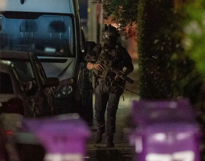 Armed police appeared to enter the property