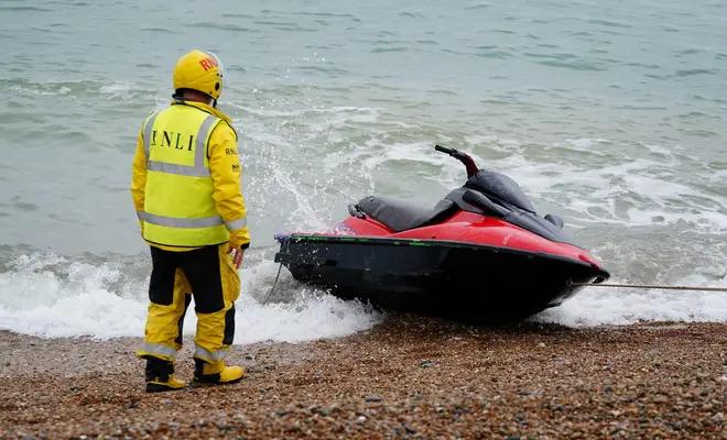 A jet-ski thought to have been used in a migrant crossing is brought in to Dungeness, Kent, by the RNLI after being intercepted in the Channel