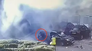 A CCTV still showing the driver, circled, escaping the taxi after the explosion.
