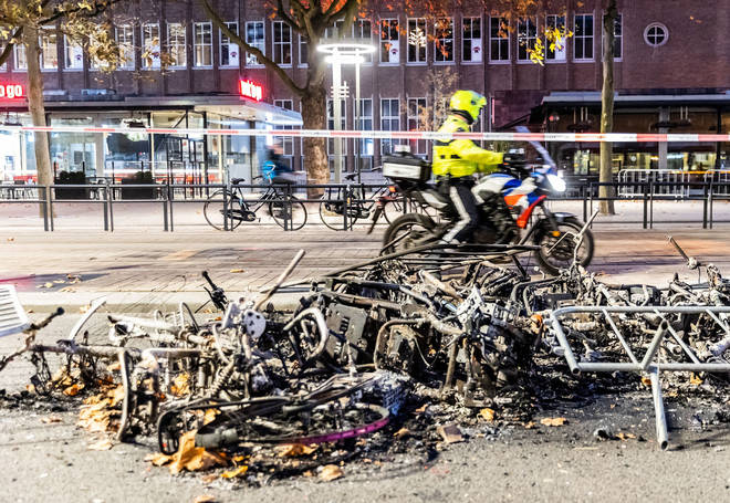 Bikes were thrown onto fires started by anti-restriction protesters in the Netherlands