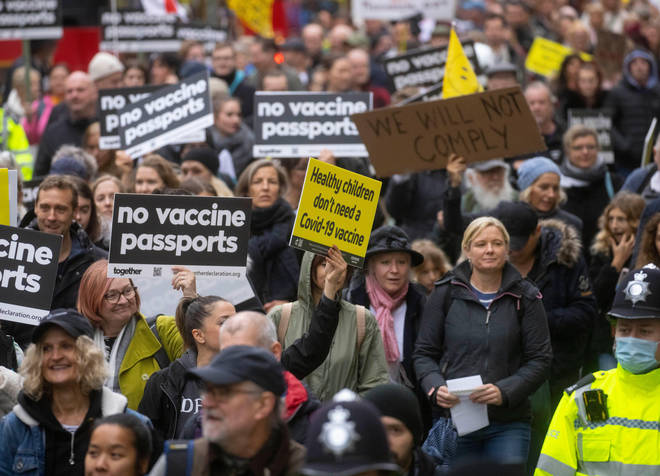 Protesters gathered outside the Austrian embassy in London yesterday, protesting the country's vaccine mandate.