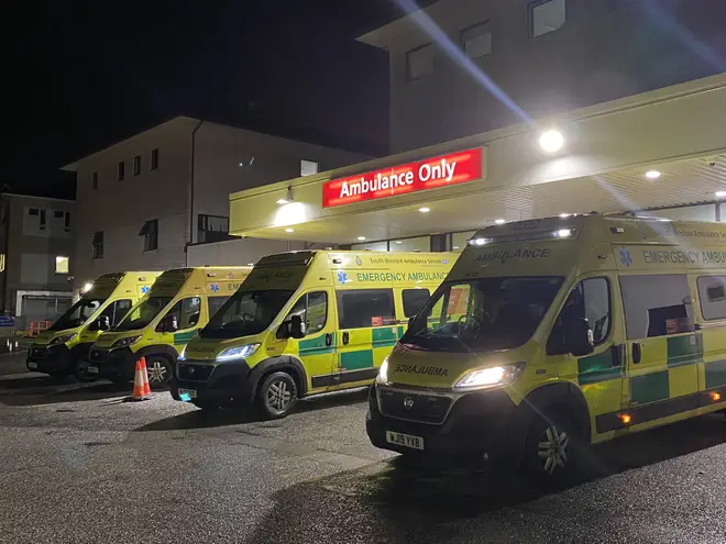 Ambulances queue outside a hospital in Cornwall waiting for beds to become free