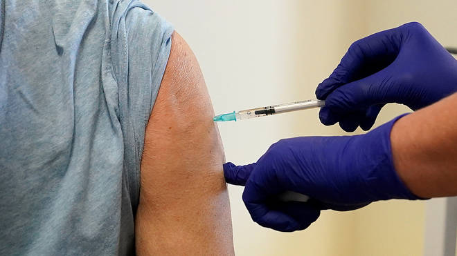 A patient receives a Covid-19 vaccine booster