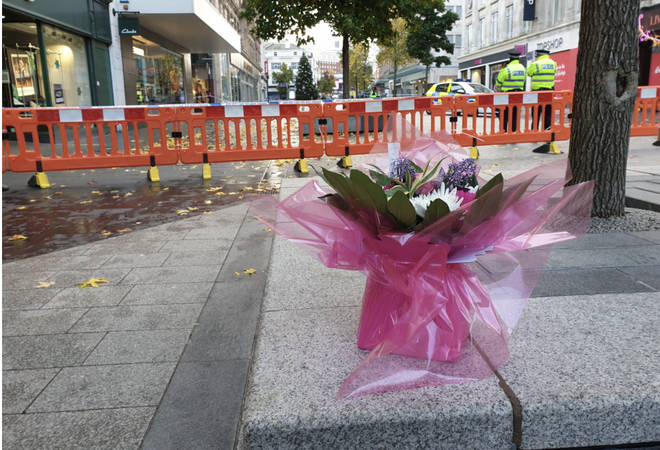 Floral tributes left at the scene with a note reading "Rest in peace angel"
