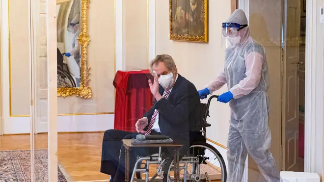 The president was wheeled in by an individual in full PPE