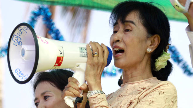 Aung San Suu Kyi speaks to her supporters using a loud-hailer