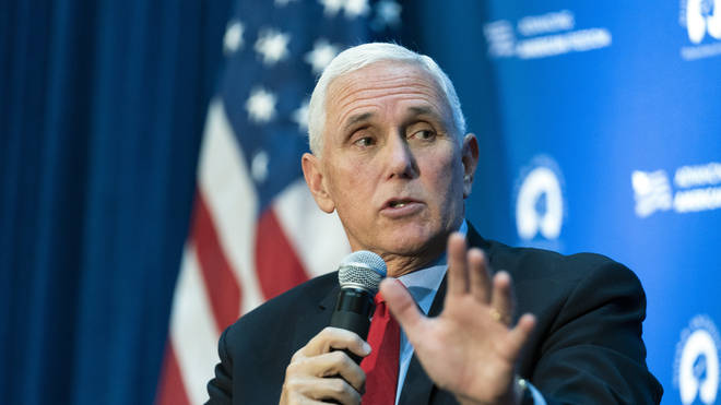 Former US vice president Mike Pence gestures while speaking about abortion